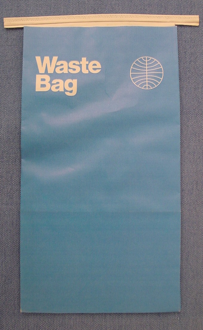 An air sick / in-flight waste bag from the early 1970s in the Helvetica style.